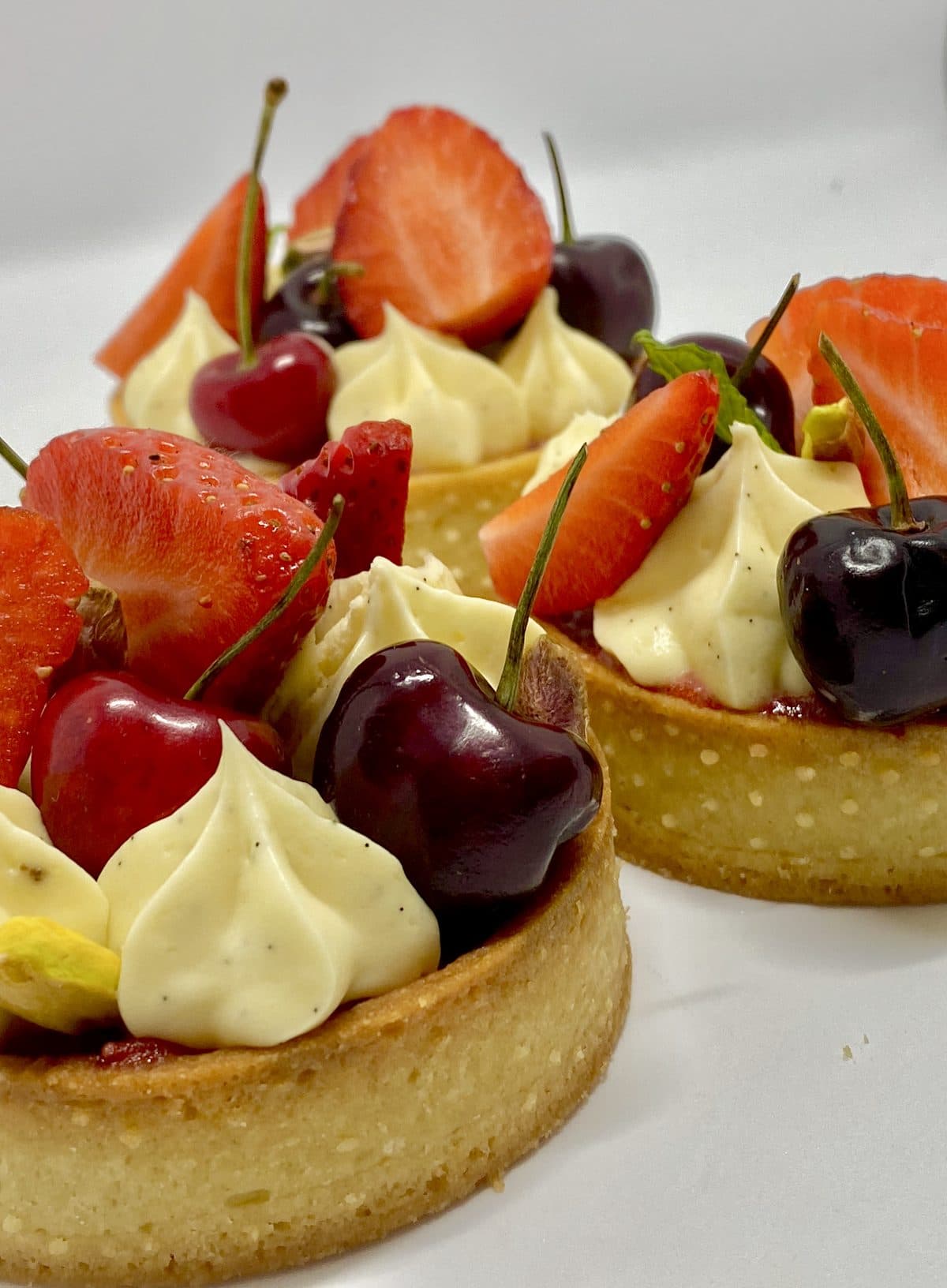 Stone fruit tart with cherries and strawberries